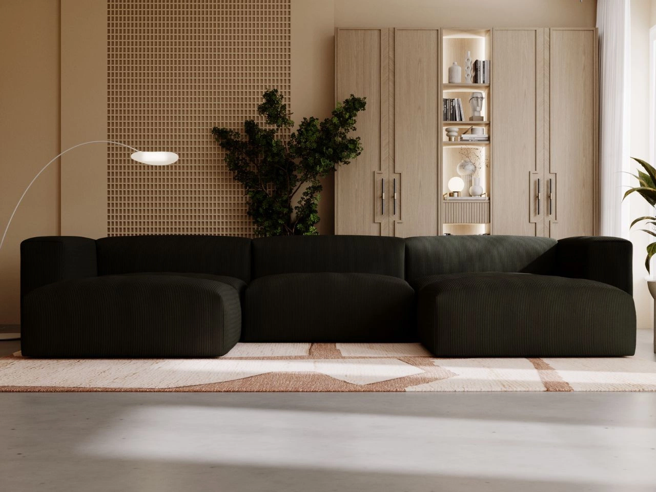 Modulares schwarzes Sofa in einem modernen, hellen Wohnzimmer